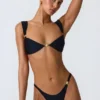 Bas de bikini échancré Volute orné, noir Bas de bikini échancré Volute orné, noir
