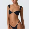 Bas de bikini échancré Volute orné, noir Bas de bikini échancré Volute orné, noir