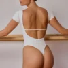 Bodys dos nu à empiècements en blanc cassé Bodys dos nu à empiècements en blanc cassé