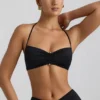 Brassière dos nu en jersey fluide avec détails métalliques Jerika, en noir Brassière dos nu en jersey fluide avec détails métalliques Jerika, en noir