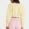 Cardigan court boutonné en jersey brossé, couleur jaune pâle Cardigan court boutonné en jersey brossé, couleur jaune pâle