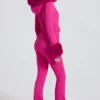Combinaison de ski ajustée imperméable à capuche en fausse fourrure, rose magenta Combinaison de ski ajustée imperméable à capuche en fausse fourrure, rose magenta