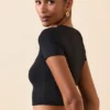 Crop top à manches courtes Myaree en noir Crop top à manches courtes Myaree en noir