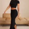 Crop top à manches courtes Myaree en noir Crop top à manches courtes Myaree en noir