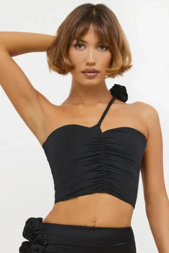 Haut asymétrique en jersey moulant avec détails roses de Tesia, couleur noir