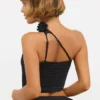 Haut asymétrique en jersey moulant avec détails roses de Tesia, couleur noir Haut asymétrique en jersey moulant avec détails roses de Tesia, couleur noir