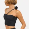 Haut asymétrique en jersey moulant avec détails roses de Tesia, couleur noir Haut asymétrique en jersey moulant avec détails roses de Tesia, couleur noir