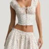 Haut corset en popeline de coton froncée Faela à imprimé de roses Haut corset en popeline de coton froncée Faela à imprimé de roses