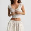 Haut corset en popeline de coton froncée Faela à imprimé de roses Haut corset en popeline de coton froncée Faela à imprimé de roses