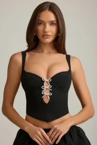 Haut corset Pearla noir avec découpes et nœuds