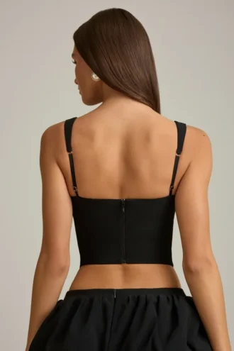 Haut corset Pearla noir avec découpes et nœuds