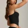 Haut corset Pearla noir avec découpes et nœuds Haut corset Pearla noir avec découpes et nœuds