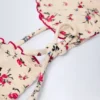 Haut de bikini triangle Noia à imprimé floral rouge Haut de bikini triangle Noia à imprimé floral rouge