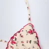 Haut de bikini triangle Noia à imprimé floral rouge Haut de bikini triangle Noia à imprimé floral rouge