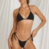 Bas de bikini string à nouer sur les côtés Kairo en noir Bas de bikini string à nouer sur les côtés Kairo en noir