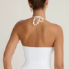 Haut dos nu à encolure halter Covia en blanc Haut dos nu à encolure halter Covia en blanc
