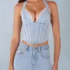 Haut style corset en denim Lotta à dos nu en denim clair Haut style corset en denim Lotta à dos nu en denim clair