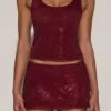 Jupe A-line à taille mi-haute et ornements Asta, couleur bordeaux Jupe A-line à taille mi-haute et ornements Asta, couleur bordeaux