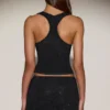 Jupe A-line à taille mi-haute et ornements Asta, en noir Jupe A-line à taille mi-haute et ornements Asta, en noir