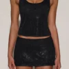 Jupe A-line à taille mi-haute et ornements Asta, en noir Jupe A-line à taille mi-haute et ornements Asta, en noir