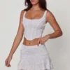 Jupe A-line à taille moyenne et ornements Lorelei en blanc