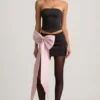Jupe Carola en satin à nœud et taille basse, couleur noire