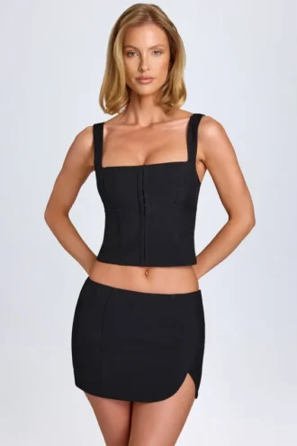 Jupe Issa à taille basse et coupe cintrée, couleur noir