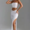 Jupe longue Pelagia à taille en V et fente sur la cuisse, en blanc Jupe longue Pelagia à taille en V et fente sur la cuisse, en blanc