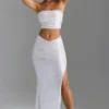 Jupe longue Pelagia à taille en V et fente sur la cuisse, en blanc Jupe longue Pelagia à taille en V et fente sur la cuisse, en blanc