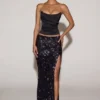 Jupe longue à taille mi-haute et fente sur la cuisse Nevara, ornée de paillettes, en noir-violet Jupe longue à taille mi-haute et fente sur la cuisse Nevara, ornée de paillettes, en noir-violet