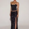 Jupe longue à taille mi-haute et fente sur la cuisse Nevara, ornée de paillettes, en noir-violet Jupe longue à taille mi-haute et fente sur la cuisse Nevara, ornée de paillettes, en noir-violet