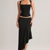 Jupe mi-longue asymétrique taille basse Niva en modal noir Jupe mi-longue asymétrique taille basse Niva en modal noir
