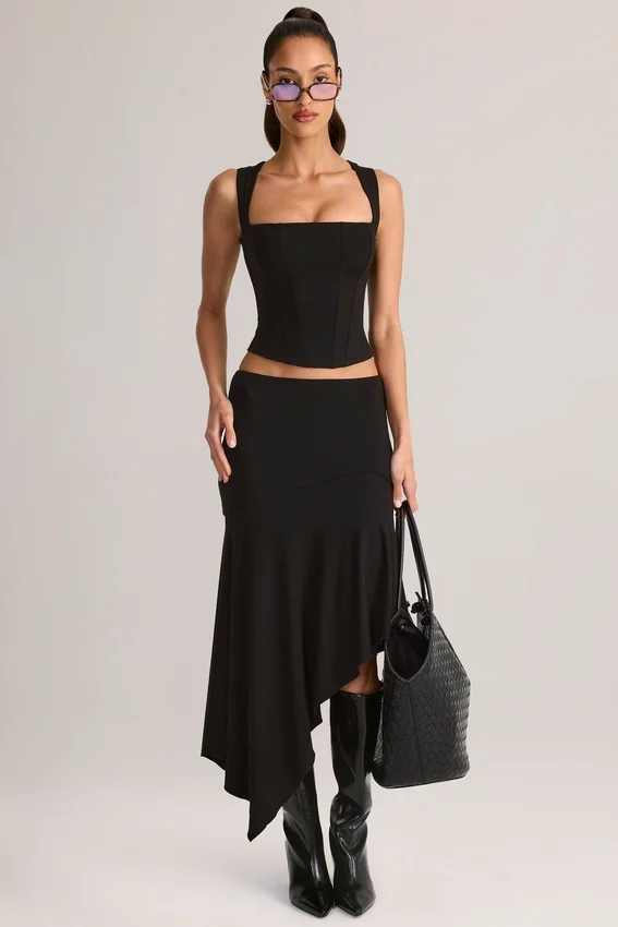 Jupe mi-longue asymétrique taille basse Niva en modal noir Jupe mi-longue asymétrique taille basse Niva en modal noir