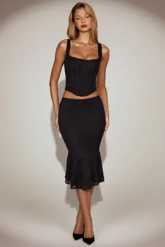 Jupe midi évasée en dentelle Fjolla, taille mi-haute, en noir