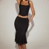 Jupe midi évasée en dentelle Fjolla, taille mi-haute, en noir Jupe midi évasée en dentelle Fjolla, taille mi-haute, en noir