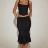 Jupe midi évasée en dentelle Fjolla, taille mi-haute, en noir Jupe midi évasée en dentelle Fjolla, taille mi-haute, en noir