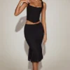 Jupe midi évasée en dentelle Fjolla, taille mi-haute, en noir Jupe midi évasée en dentelle Fjolla, taille mi-haute, en noir