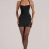 Jupe moulante taille moyenne Tula avec fente, en noir Jupe moulante taille moyenne Tula avec fente, en noir