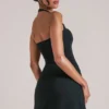 Jupe moulante taille moyenne Tula avec fente, en noir Jupe moulante taille moyenne Tula avec fente, en noir