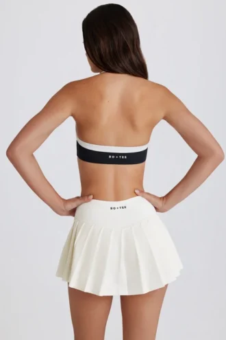 Jupe-short de tennis plissée Soft Active à taille basse, couleur ivoire