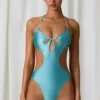 Maillot de bain 1 pièce dos nu à découpes et détails perles Melo Melo, couleur turquoise Maillot de bain 1 pièce dos nu à découpes et détails perles Melo Melo, couleur turquoise