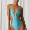 Maillot de bain 1 pièce dos nu à découpes et détails perles Melo Melo, couleur turquoise Maillot de bain 1 pièce dos nu à découpes et détails perles Melo Melo, couleur turquoise