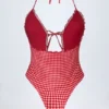 Maillot de bain 1 pièce dos nu à volants et découpes Montjoi en vichy rouge Maillot de bain 1 pièce dos nu à volants et découpes Montjoi en vichy rouge