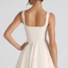 Micro-mini-robe trapèze à nœud Nanisca, couleur ivoire