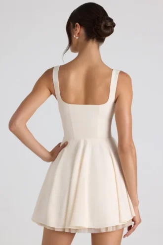 Micro-mini-robe trapèze à nœud Nanisca, couleur ivoire