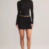 Mini-jupe Cali en modal froncé à taille mi-haute, en noir Mini-jupe Cali en modal froncé à taille mi-haute, en noir