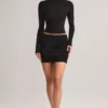Mini-jupe Cali en modal froncé à taille mi-haute, en noir Mini-jupe Cali en modal froncé à taille mi-haute, en noir