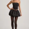 Mini-jupe Clemmy à ourlet bouffant et taille mi-haute, en noir Mini-jupe Clemmy à ourlet bouffant et taille mi-haute, en noir