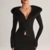 Mini-jupe en maille Tova à taille mi-haute, couleur noire Mini-jupe en maille Tova à taille mi-haute, couleur noire