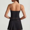 Mini-jupe plissée à taille basse et ceinture Velora, en noir Mini-jupe plissée à taille basse et ceinture Velora, en noir